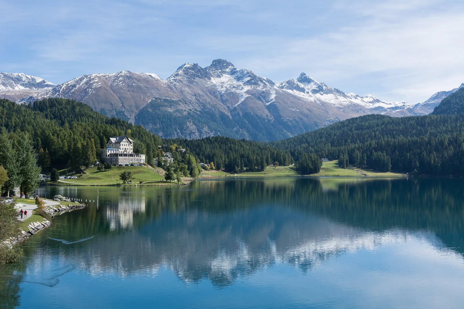 Lake St. Moritz reflecting the peaks of the Engadin